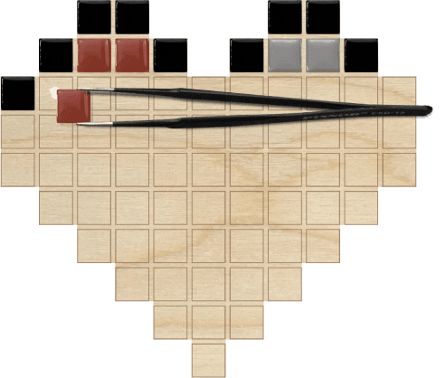 Figure 3: tweezers placing a mosaic tile into the board guide.